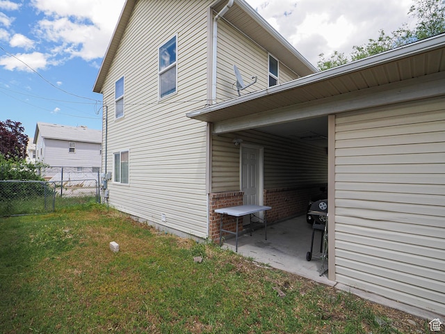 787 W Lennox St S, Midvale, UT 84047 - view of property exterior featuring brick siding and a patio