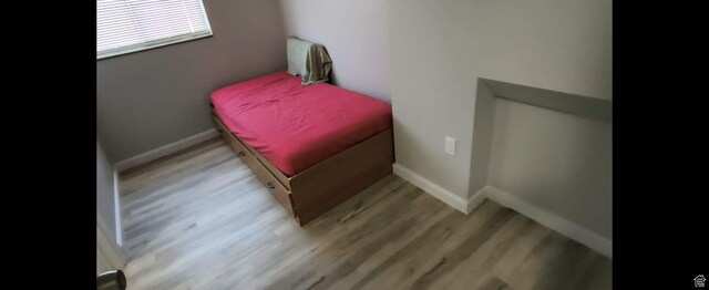 1004 N Sir Michael Dr, Salt Lake City, UT 84116 - bedroom with wood finished floors and baseboards