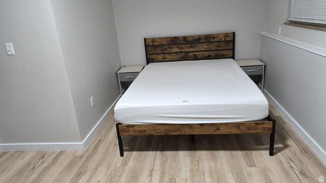 1004 N Sir Michael Dr, Salt Lake City, UT 84116 - bedroom with wood finished floors and baseboards