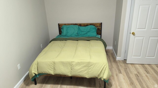 1004 N Sir Michael Dr, Salt Lake City, UT 84116 - bedroom featuring light wood finished floors and baseboards