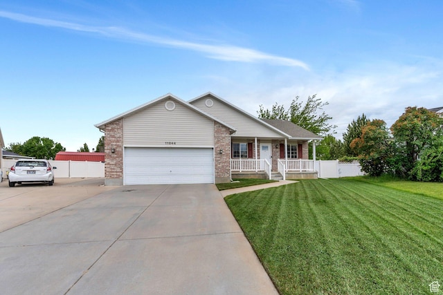 11844 S Logans Run Cv, Herriman, UT 84096 - ranch-style house featuring covered porch, driveway, brick siding, and an attached garage