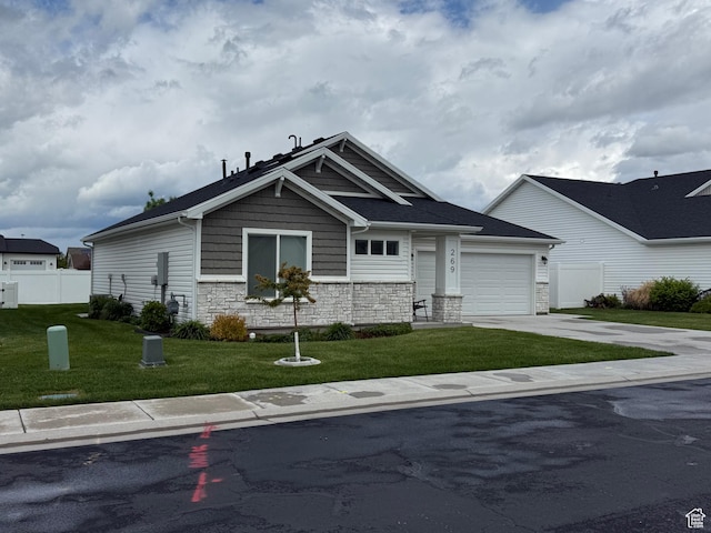269 W 520 S, Hyde Park, UT 84318 - craftsman-style home featuring driveway, stone siding, and a garage