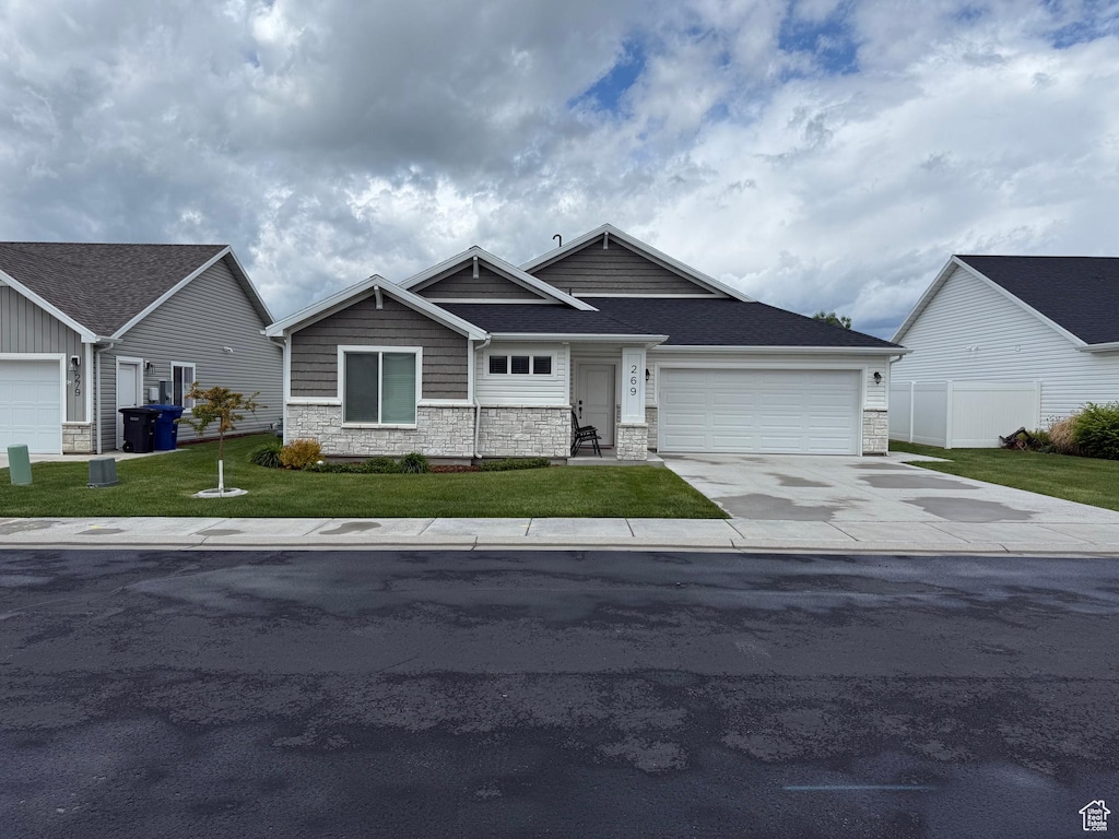 269 W 520 S, Hyde Park, UT 84318 - craftsman inspired home with stone siding, an attached garage, driveway, and a shingled roof