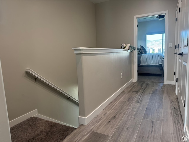 15456 S Navy Trails Ln W, Bluffdale, UT 84065 - hallway with an upstairs landing, wood finished floors, and baseboards