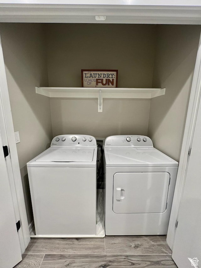 15456 S Navy Trails Ln W, Bluffdale, UT 84065 - washroom with washing machine and clothes dryer and wood finished floors