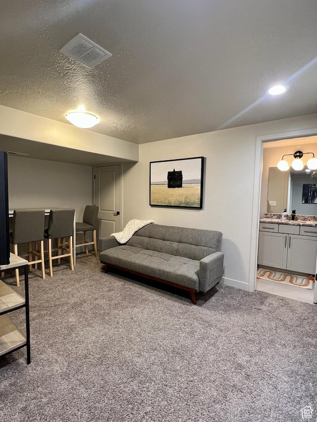 15456 S Navy Trails Ln W, Bluffdale, UT 84065 - carpeted living area with a textured ceiling, baseboards, and recessed lighting