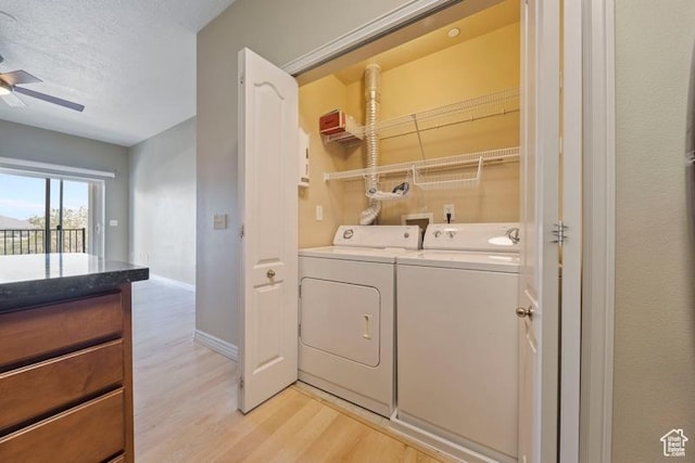 1134 E 3300th St S Unit 416, Salt Lake City, UT 84106 - laundry room with washer and clothes dryer, light wood-type flooring, baseboards, and ceiling fan