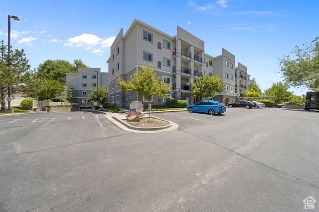 1134 E 3300th St S Unit 416, Salt Lake City, UT 84106 - view of building exterior featuring uncovered parking