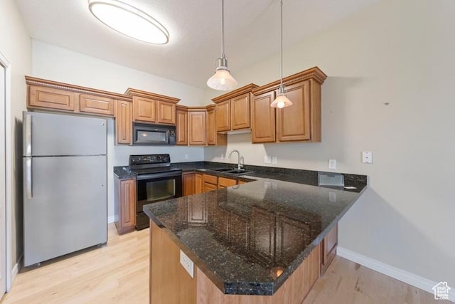 1134 E 3300th St S Unit 416, Salt Lake City, UT 84106 - kitchen with black appliances, a sink, a peninsula, light wood-style floors, and brown cabinets