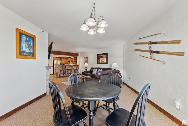 1485 Empire Ave Unit 201, Park City, UT 84060 - dining room featuring baseboards, a chandelier, carpet, and a textured wall