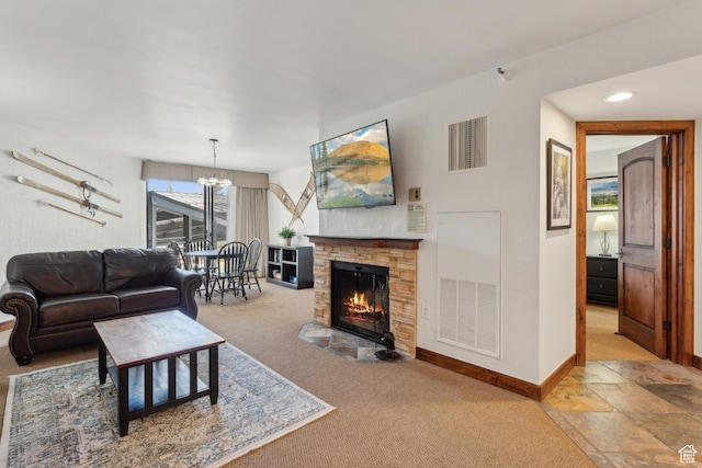 1485 Empire Ave Unit 201, Park City, UT 84060 - living room featuring a fireplace, carpet floors, a chandelier, and baseboards