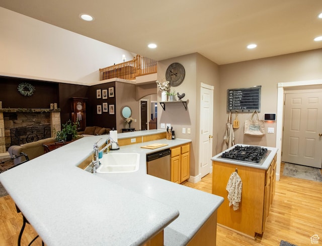 954 E 960 S, Ephraim, UT 84627 - kitchen with dishwasher, a sink, gas stovetop, a center island, and a fireplace