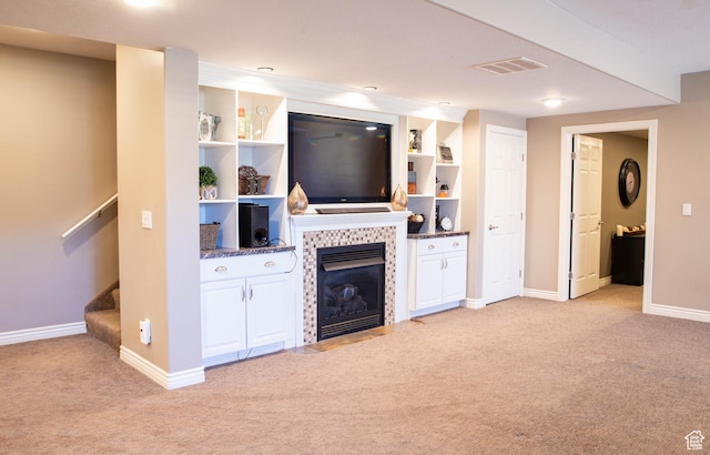 954 E 960 S, Ephraim, UT 84627 - living area featuring light colored carpet, a tile fireplace, baseboards, and stairway