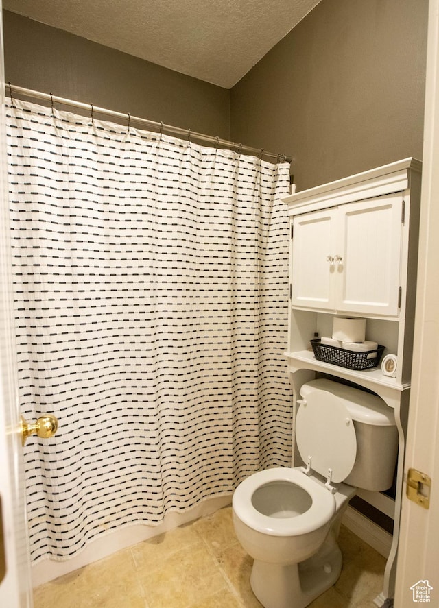 954 E 960 S, Ephraim, UT 84627 - bathroom with toilet, a textured ceiling, tile patterned floors, and a shower with shower curtain