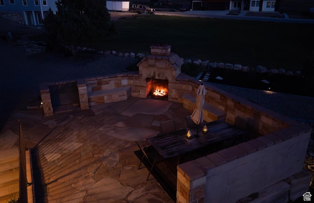 954 E 960 S, Ephraim, UT 84627 - patio at night with an outdoor stone fireplace, a patio, and a fire pit
