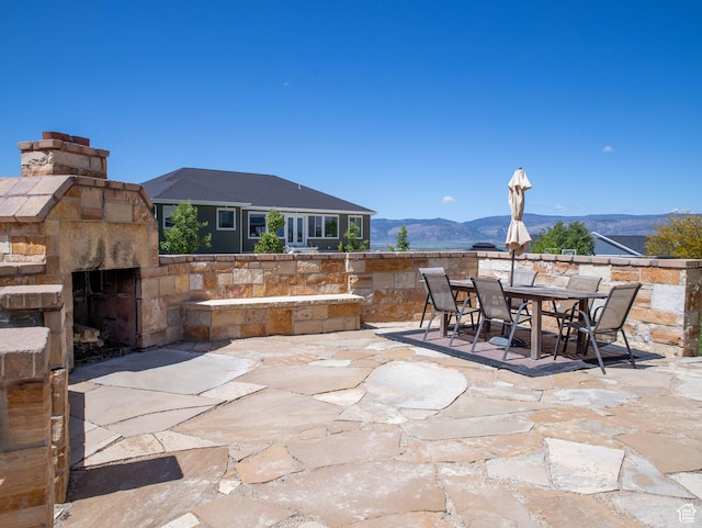 954 E 960 S, Ephraim, UT 84627 - view of patio with outdoor dining space, a mountain view, and an outdoor stone fireplace