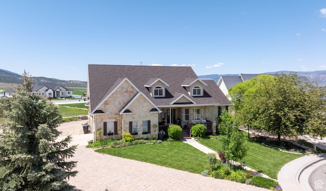 954 E 960 S, Ephraim, UT 84627 - view of front of property with stone siding, a porch, a front yard, a mountain view, and decorative driveway