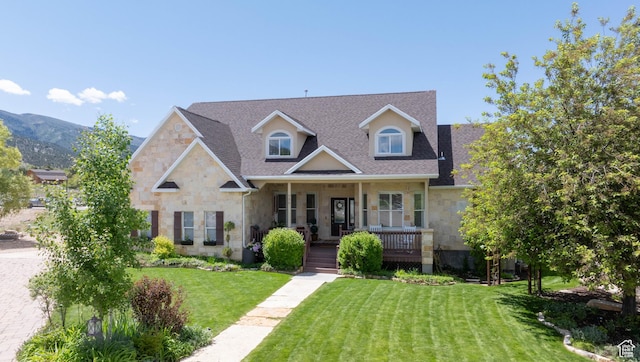 954 E 960 S, Ephraim, UT 84627 - view of front of property with stone siding, covered porch, a front yard, and a shingled roof