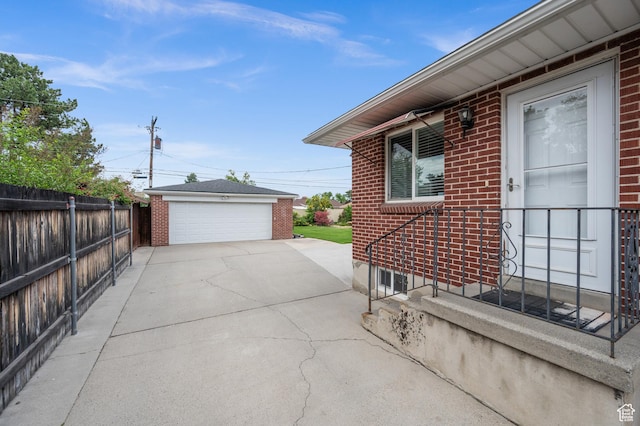 475 E 6815 S, Midvale, UT 84047 - view of property exterior featuring brick siding, a garage, and an outbuilding
