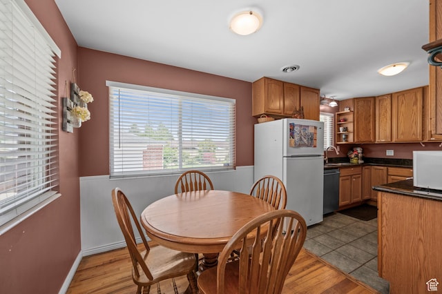 475 E 6815 S, Midvale, UT 84047 - dining space featuring healthy amount of natural light, light wood finished floors, and a wainscoted wall