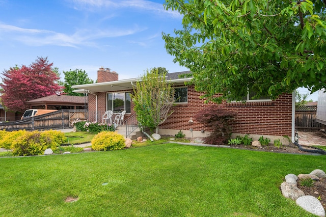 475 E 6815 S, Midvale, UT 84047 - view of front of property with brick siding and a chimney