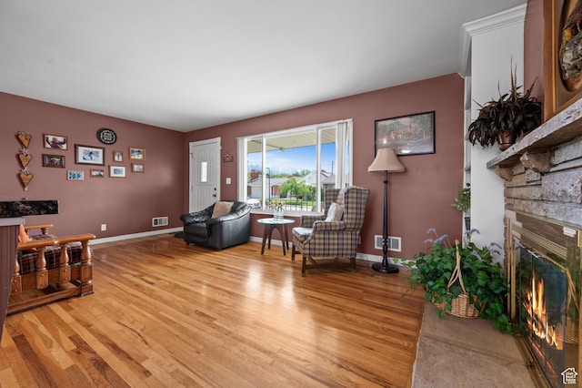 475 E 6815 S, Midvale, UT 84047 - living room with light wood finished floors, a fireplace, and baseboards
