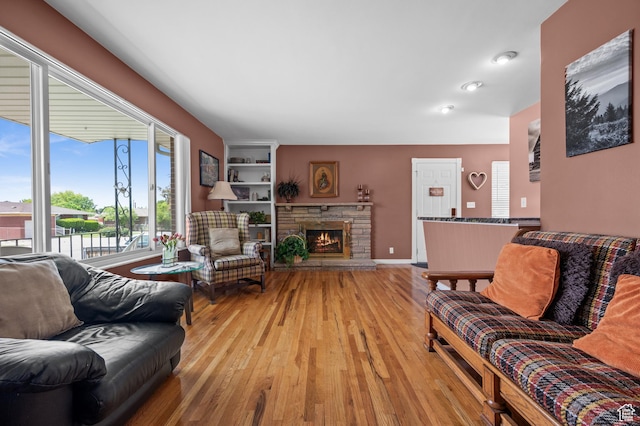 475 E 6815 S, Midvale, UT 84047 - living area featuring light wood-type flooring and a fireplace