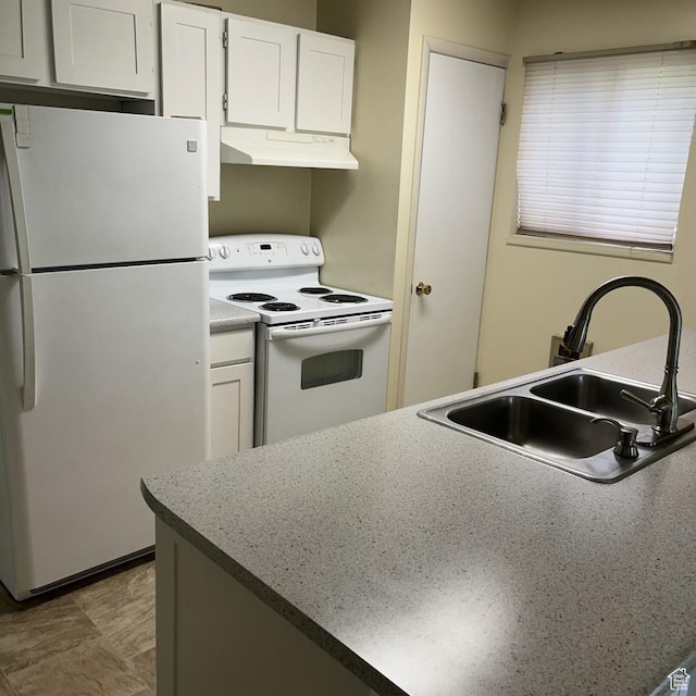 631 N 1150 W, Provo, UT 84601 - kitchen with white appliances, under cabinet range hood, and white cabinets