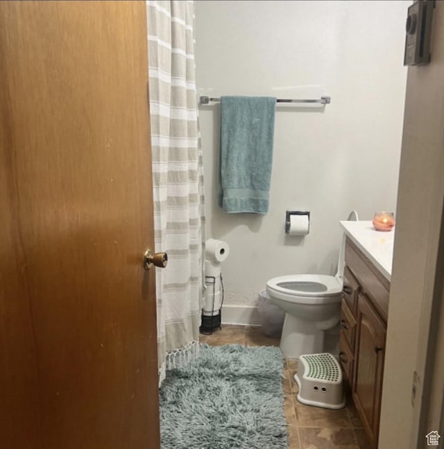 631 N 1150 W, Provo, UT 84601 - full bathroom featuring toilet, tile patterned flooring, vanity, baseboards, and a shower with shower curtain