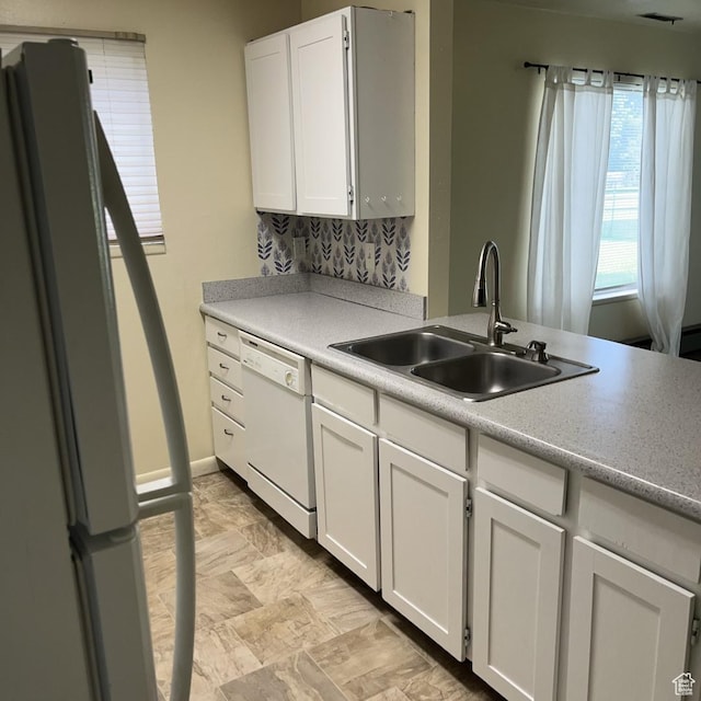 631 N 1150 W, Provo, UT 84601 - kitchen with white appliances, white cabinets, light countertops, and tasteful backsplash