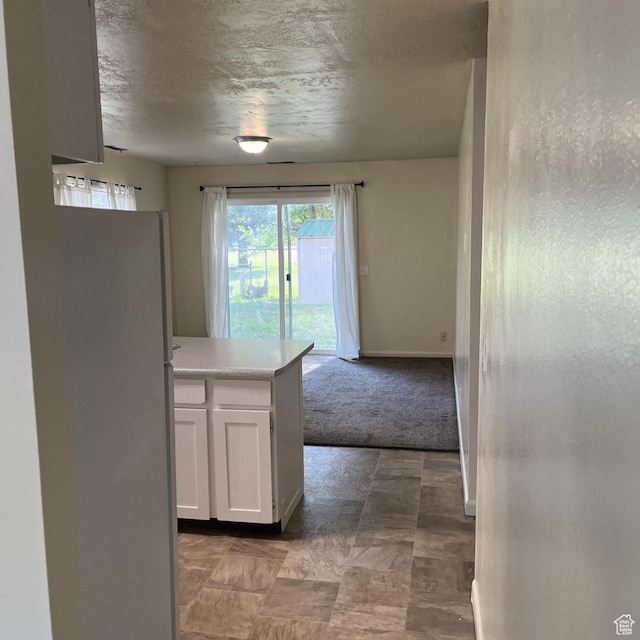 631 N 1150 W, Provo, UT 84601 - kitchen with freestanding refrigerator, white cabinets, light countertops, and open floor plan