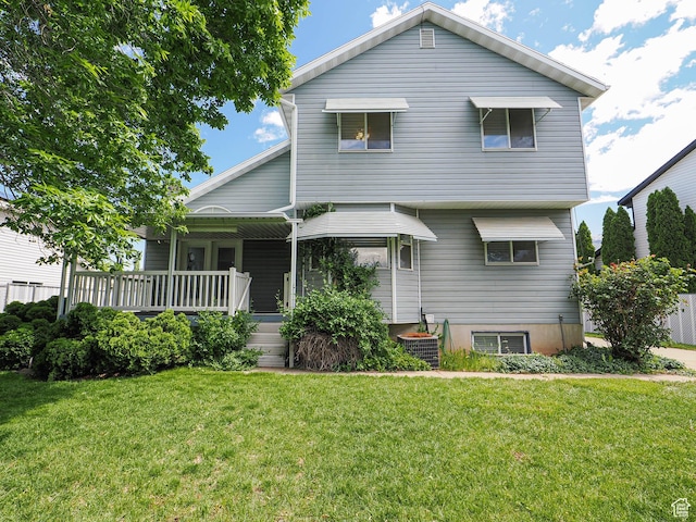 1090 E 2125 N, Layton, UT 84041 - view of front of home featuring a front lawn, covered porch, and cooling unit