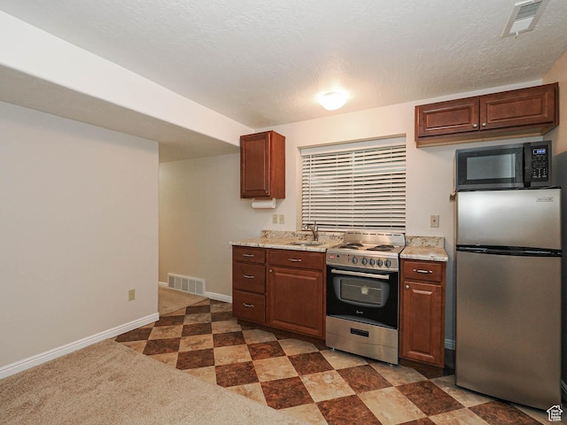 1090 E 2125 N, Layton, UT 84041 - kitchen with stainless steel appliances, a sink, baseboards, and light stone counters