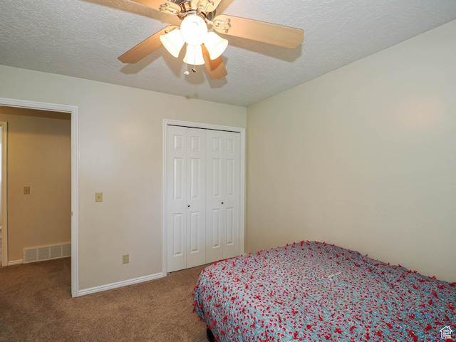 1090 E 2125 N, Layton, UT 84041 - carpeted bedroom featuring a closet, a textured ceiling, a ceiling fan, and baseboards