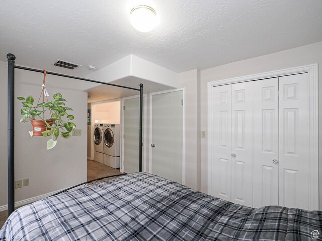 1090 E 2125 N, Layton, UT 84041 - unfurnished bedroom with washing machine and dryer, carpet, a closet, and a textured ceiling