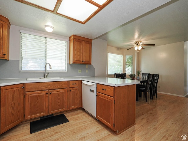 1090 E 2125 N, Layton, UT 84041 - kitchen with a sink, a peninsula, white dishwasher, and light wood finished floors