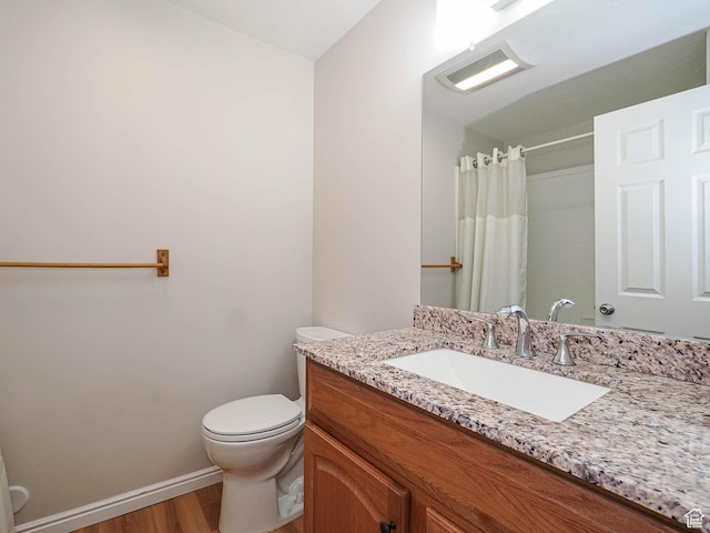 1090 E 2125 N, Layton, UT 84041 - full bathroom with wood finished floors, toilet, baseboards, vanity, and a shower with shower curtain