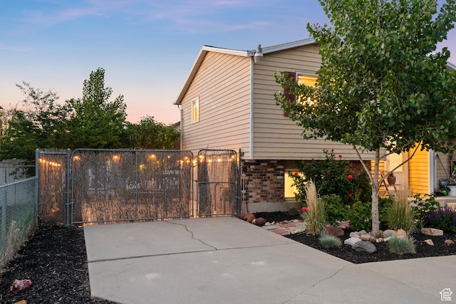 2276 W Bonniebrook Cir S, Taylorsville, UT 84129 - view of side of home with a gate and brick siding