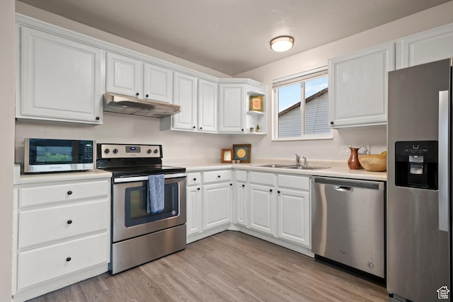 2276 W Bonniebrook Cir S, Taylorsville, UT 84129 - kitchen featuring stainless steel appliances, under cabinet range hood, a sink, and white cabinetry