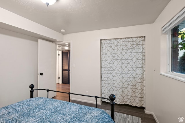 2276 W Bonniebrook Cir S, Taylorsville, UT 84129 - bedroom featuring wood finished floors and baseboards