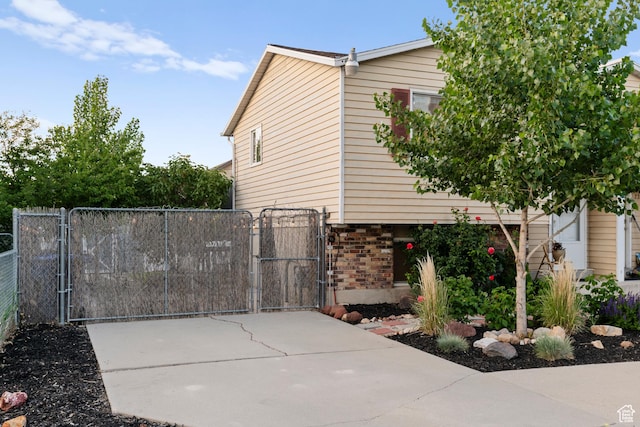 2276 W Bonniebrook Cir S, Taylorsville, UT 84129 - view of home's exterior with a gate and brick siding