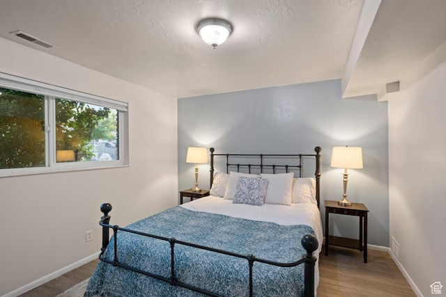 2276 W Bonniebrook Cir S, Taylorsville, UT 84129 - bedroom with wood finished floors and baseboards