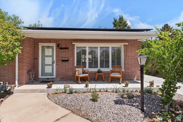 2377 S 150 E, Bountiful, UT 84010 - property entrance featuring covered porch and brick siding