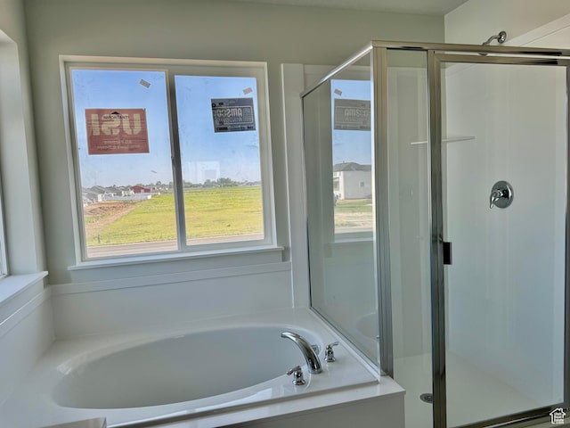 3807 W 1780 S Unit 213, Taylor, UT 84401 - full bathroom featuring plenty of natural light, a garden tub, and a shower stall