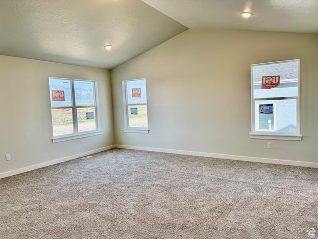 3807 W 1780 S Unit 213, Taylor, UT 84401 - carpeted spare room featuring vaulted ceiling, baseboards, and a textured ceiling