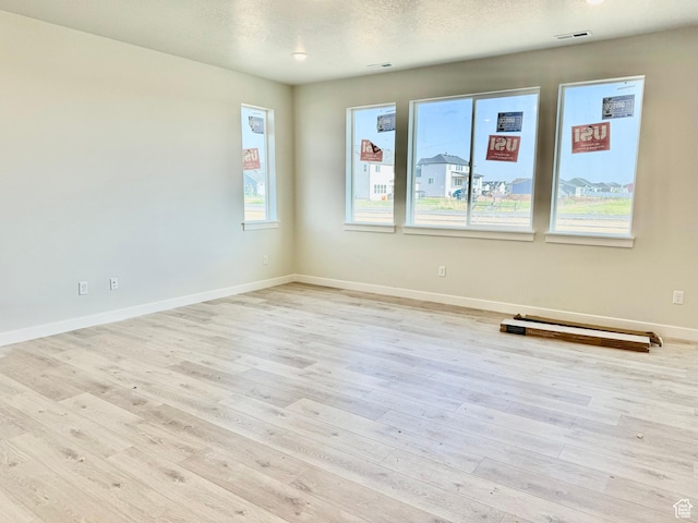 3807 W 1780 S Unit 213, Taylor, UT 84401 - unfurnished room with light wood finished floors and baseboards