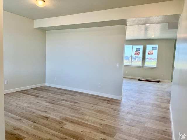 3807 W 1780 S Unit 213, Taylor, UT 84401 - empty room with light wood-type flooring and baseboards