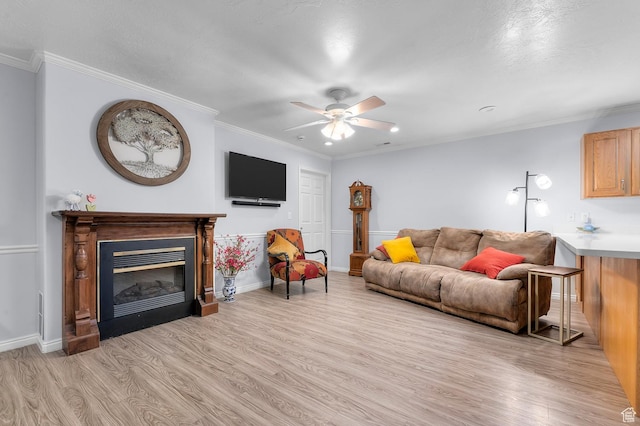 429 W 90 N, American Fork, UT 84003 - living room featuring light wood-style flooring, ceiling fan, a glass covered fireplace, ornamental molding, and baseboards