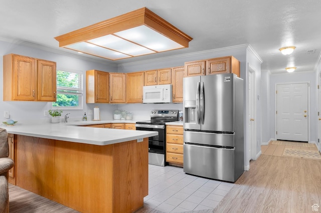 429 W 90 N, American Fork, UT 84003 - kitchen featuring appliances with stainless steel finishes, a peninsula, ornamental molding, light countertops, and light tile patterned flooring