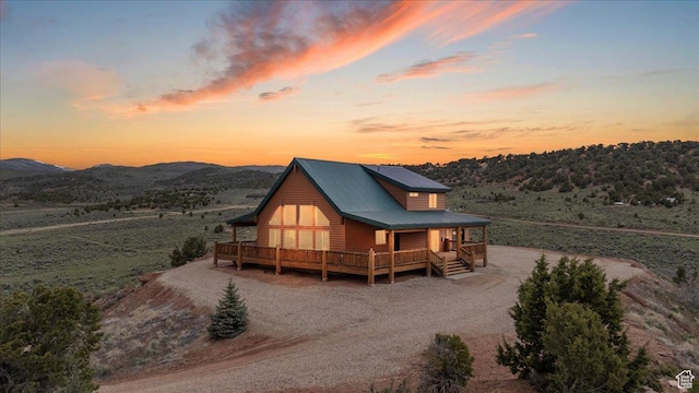 46982 W Thunder Ridge Rd, Fruitland, UT 84027 - chalet / cabin with faux log siding, metal roof, and covered porch